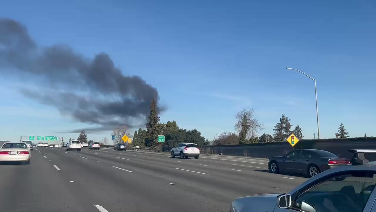 The 2-alarm fire in San Leandro continues to burn. It was reported at about 9am.  Smoke from the fire is visible several miles away