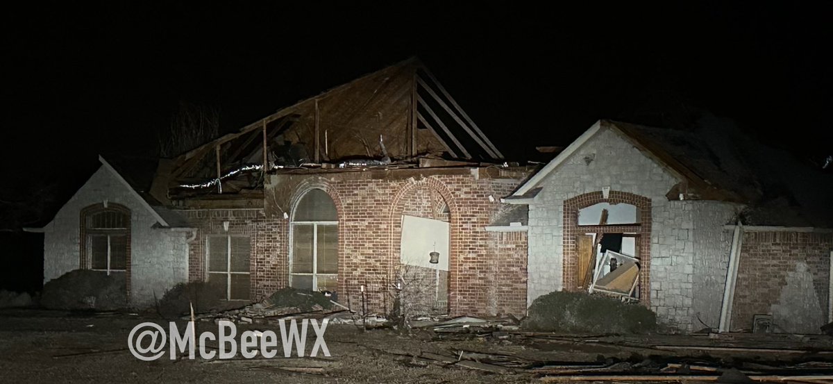 A tornado struck parts of Norman, OK Sunday evening, removing part of the roof of this home and causing damage to many others on the east side of town