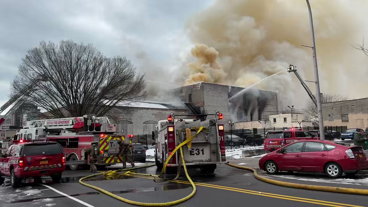 Large fire in downtown Buffalo. flames coming from the ceiling of the building