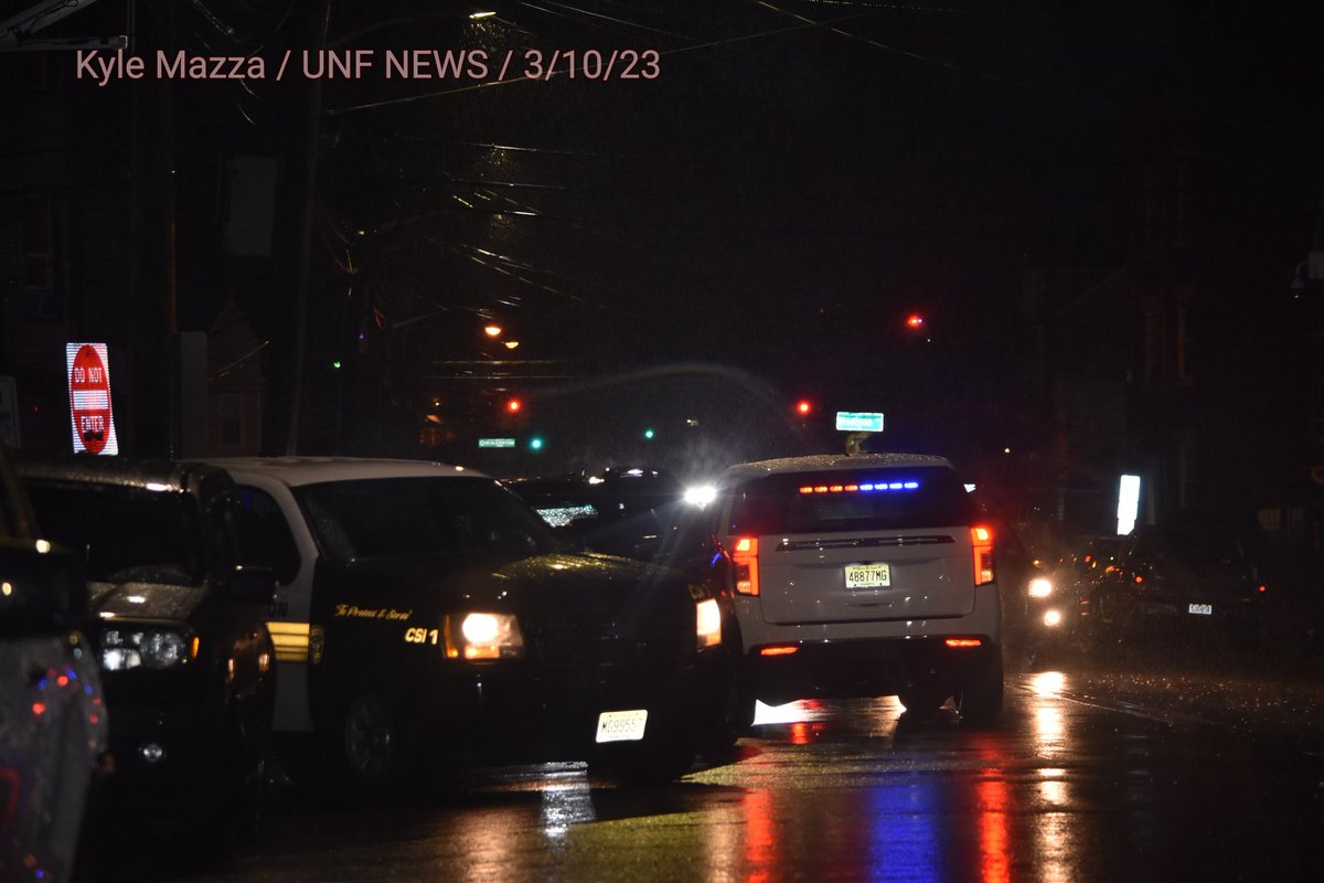 Shooting on 12th Avenue in Paterson, New Jersey on March 10, 2023. Friday evening, police vehicles were on the scene and Paterson police officers shined flashlights on the ground and shined their flashlights underneath vehicles and on sidewalks to search for evidence