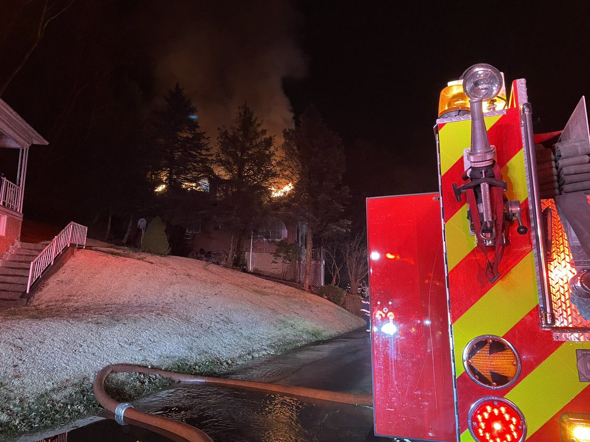 Flames are shooting out of a house on Oak Avenue Extension in Turtle Creek