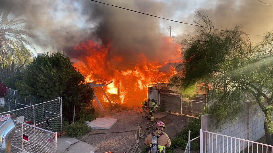Firefighters are on the scene of a two story house fire near 16th St & Camelback Rd.