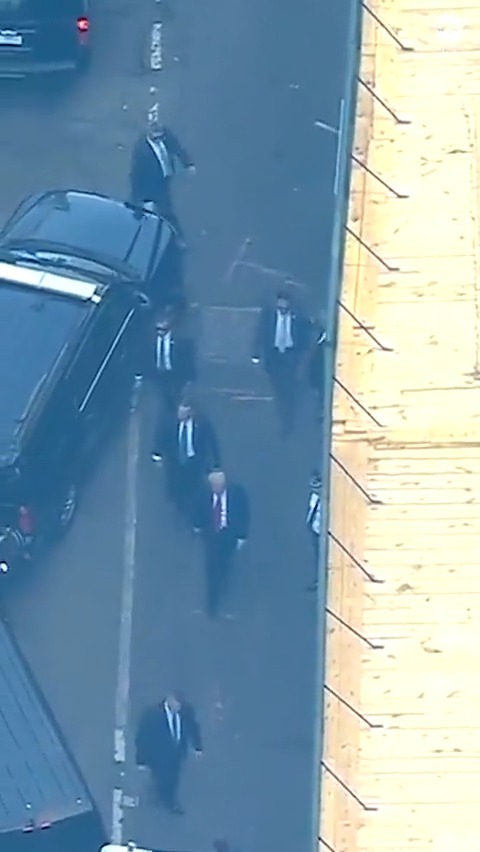 Aerial view shows former President Donald Trump arriving at a Manhattan courthouse for his arraignment.