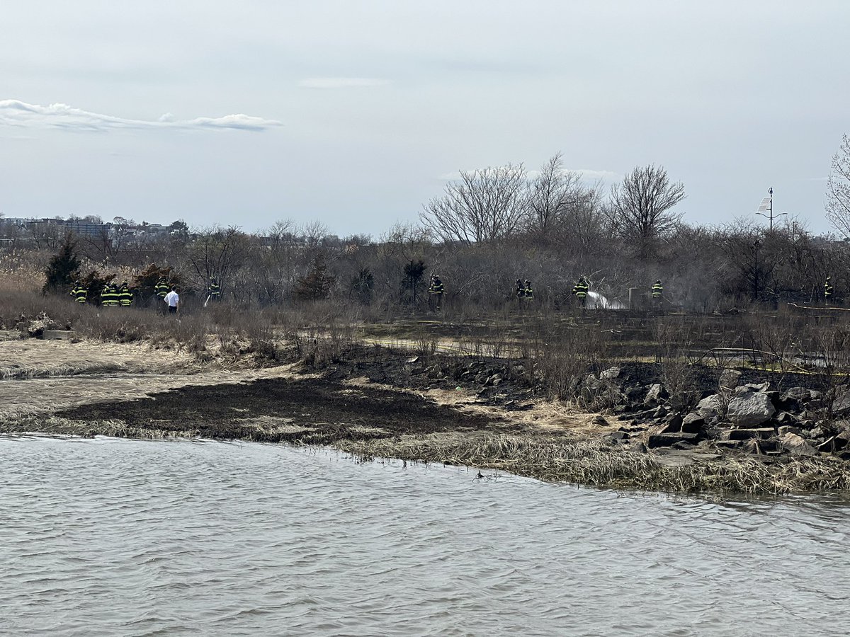 Here's Quincy Fire handling a brush fire off of Commander Shea Blvd. The fire is out. A Quincy Police Officer told the wind is what made this hard to put out. He also mentioned the location was in a tough spot to fight it