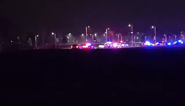 A procession has just arrived at the Midwest Medical Examiner's Office in Ramsey, Minn. with the body of a fallen Pope County deputy after he and two other law enforcement officers were shot while responding to a domestic incident in Cyrus