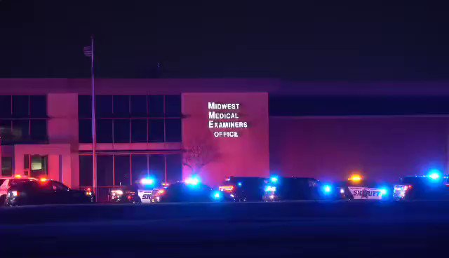 Outside the medical examiner's office in Ramsey, where the body of a Pope County deputy has arrived after he was killed in the line of duty