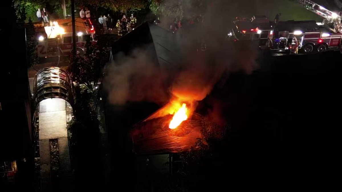 Heavy fire coming from a house on Francis St in Swissvale. Neighbor tells 2 people inside escaped. SkyEye2 over the flames shooting from the rear of the house.