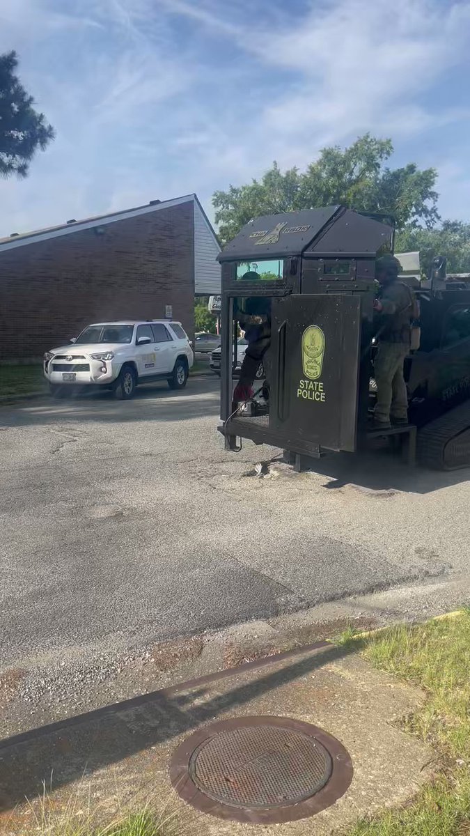 State Police in an armored truck and tactical gear enter the Newport Commons apartments. Police say a man was shot at 10 last night, and a possible suspect barricaded themselves inside an apartment. The person shot is expected to be okay.