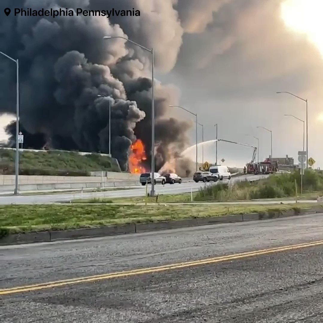 A Fuel Tanker has caught fire and exploded underneath Interstate highway 95 causing the entire northbound overpass to collapse Philadelphia. Currently, multiple emergency crews and other emergency agencies are on scene to a major fire after a fuel tanker, caught fire and exploded underneath Interstate 95 highway and has caused the entire northbound overpass to collapse as morning rush hours hits in Philadelphia, Pennsylvania multiple people are reporting thick black smoke as it can be seen miles away, Police have shutdown all north and southbound lanes Due to exploding manholes, firefighters are urging the public to steer clear of these areas