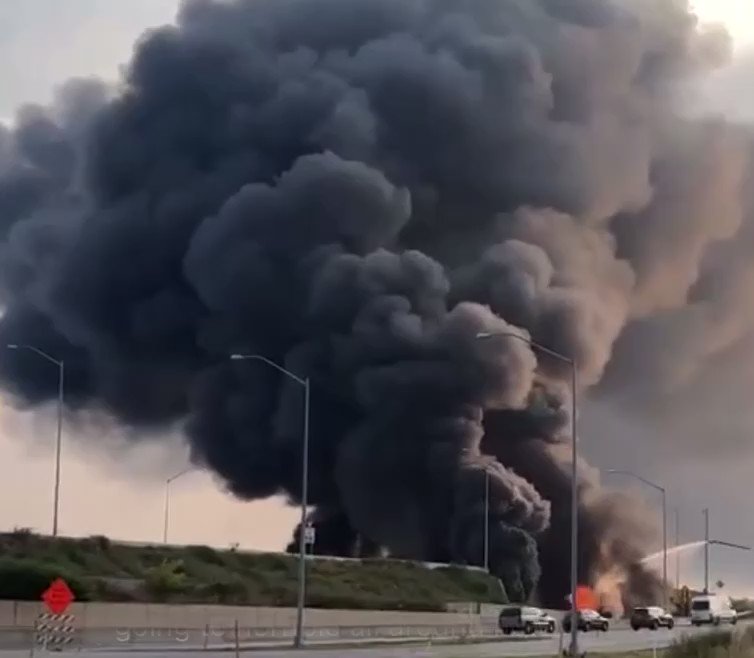 After the I-95 Northbound lanes collapsed down, the flames from the intense fire still were going way above the highway through the suddenly opened up portion of 95