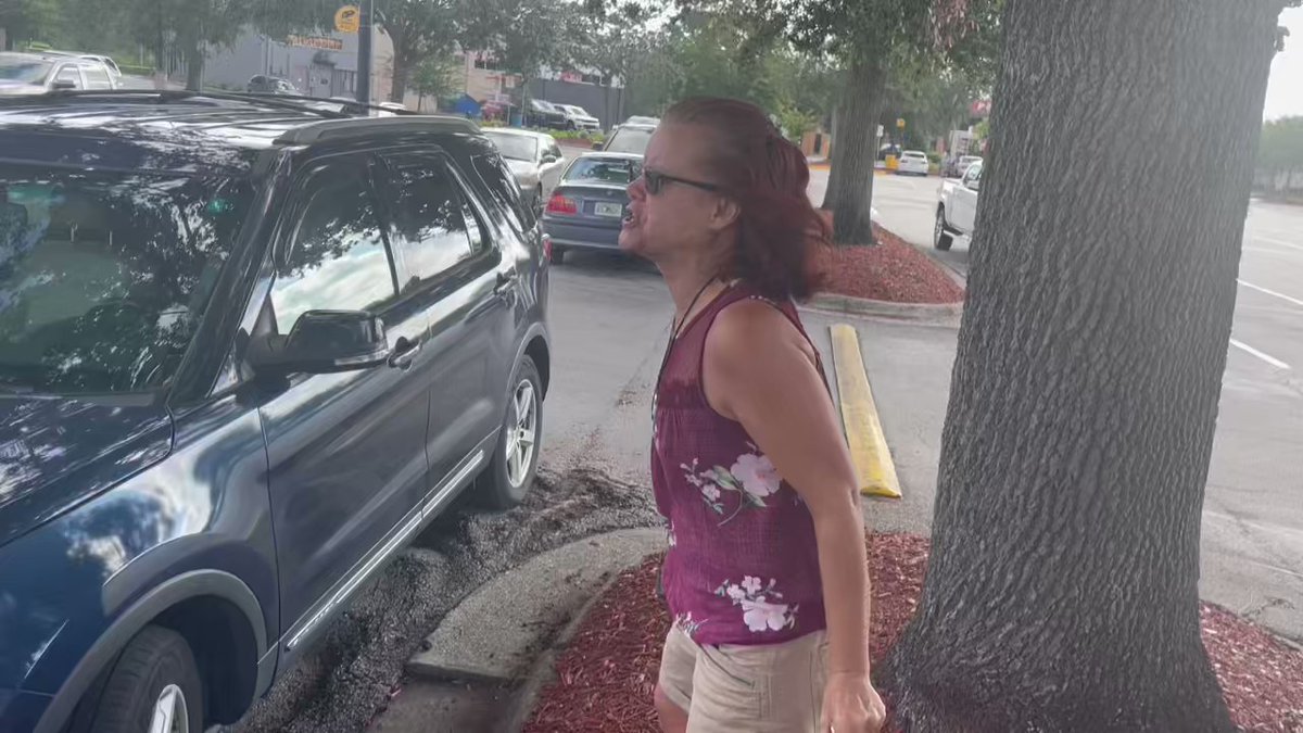 As Trump supporters get on buses at a @Walmart in Orlando to go to his arraignment in Miami, one woman calls them traitors