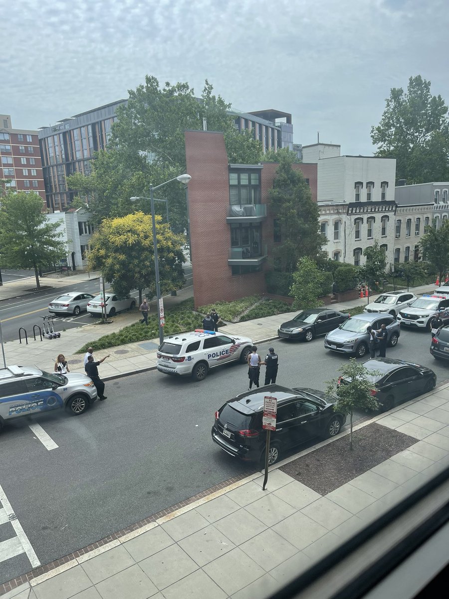 INCOMING PHOTO that shows Howard University Police and Mpd on the scene with two men apprehended after this mornings shooting