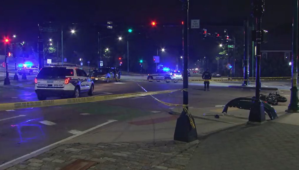 Apparent crash involving at least one car and a motorcycle shuts down busy intersection in Jamaica Plain across from the Forest Hills @MBTA station.