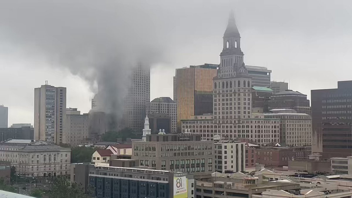 Appears like a tall building in downtown Hartford is on fire. Smoke is billowing into the dark sky. nnYou can hear the emergency vehicles heading that way. This area was just hit with flashing flooding and thunderstorms within the past hour
