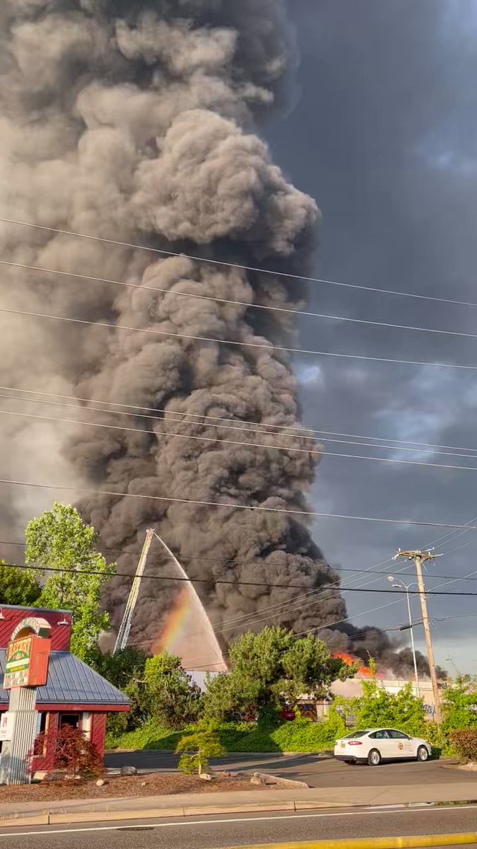 This massive plume of smoke coming from the fire can be seen for miles. Roadways are slowly becoming coated in thick chunks of ashes