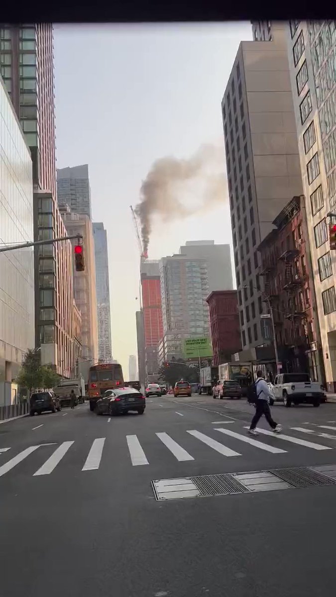 A towering construction crane caught fire high above the West Side of Manhattan Wednesday morning.