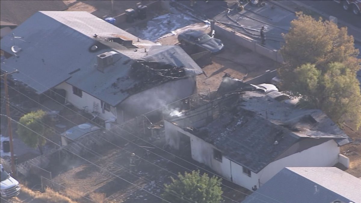 6 people displaced, dog rescued after car fire spreads to 2 homes in Phoenix: