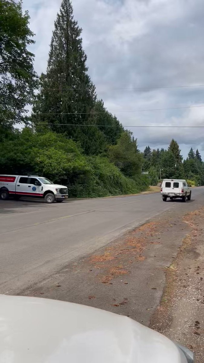 Fire vehicles are leaving the scene at NW Old St. Helens Hwy in Scappoose where at least 2 people were killed in a house fire early this morning. Authorities said a third person could be inside as well