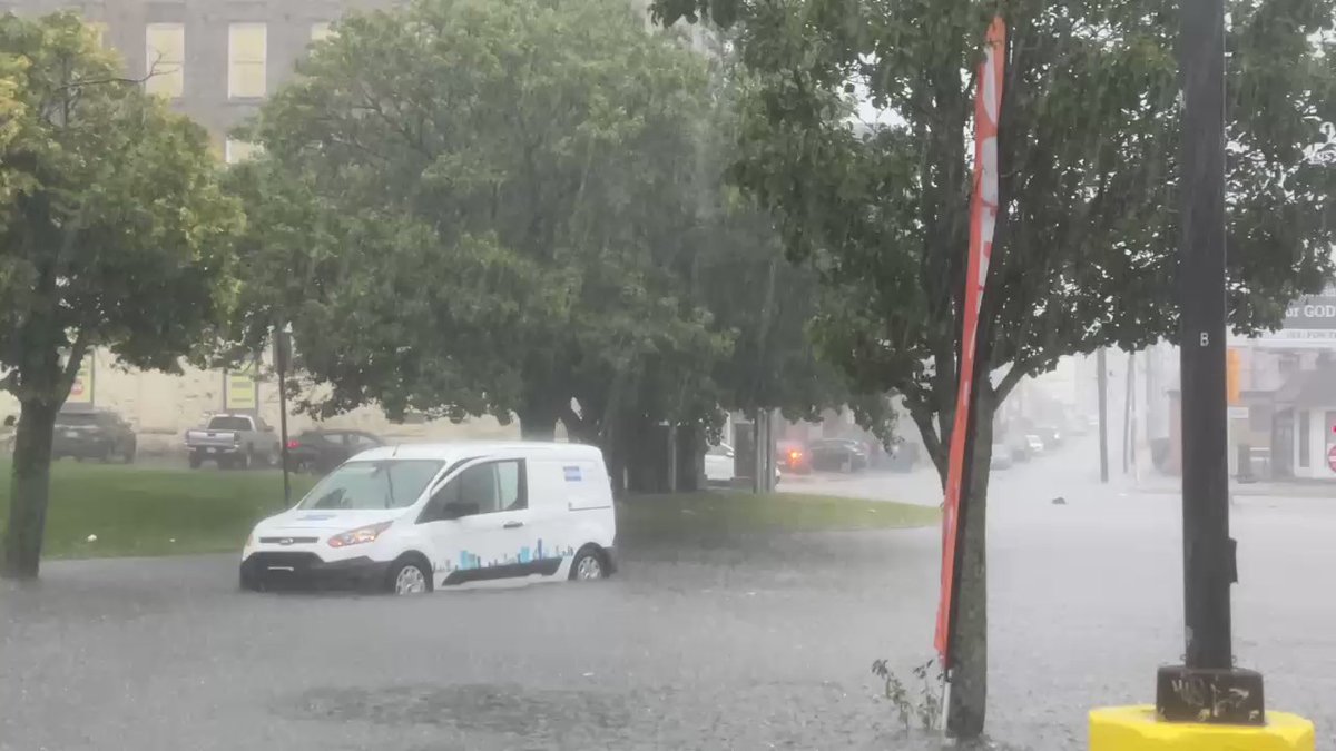 A vehicle is stuck in the water in Fall River as a flash flood warning is in effect for parts of Southern New England until 2 p.m. today.