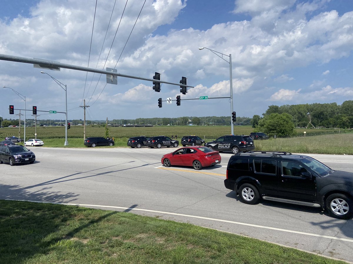 Bellevue near HWY 370  and  25th street where there is a large police presence surrounding a corn field