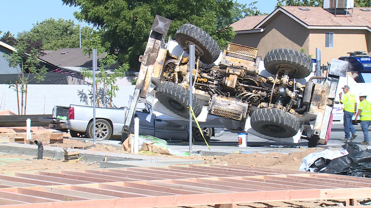 A construction crane tipped over Thursday in Fresno, nearly slicing a parked truck in half