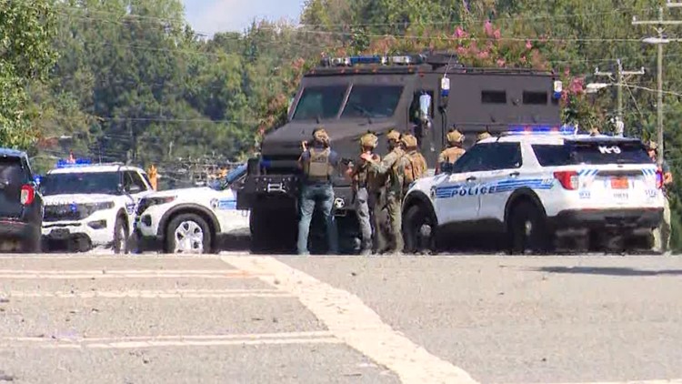 Police are asking people to avoid the area around the intersection of Albemarle Road and W.T. Harris Boulevard due to an active SWAT situation
