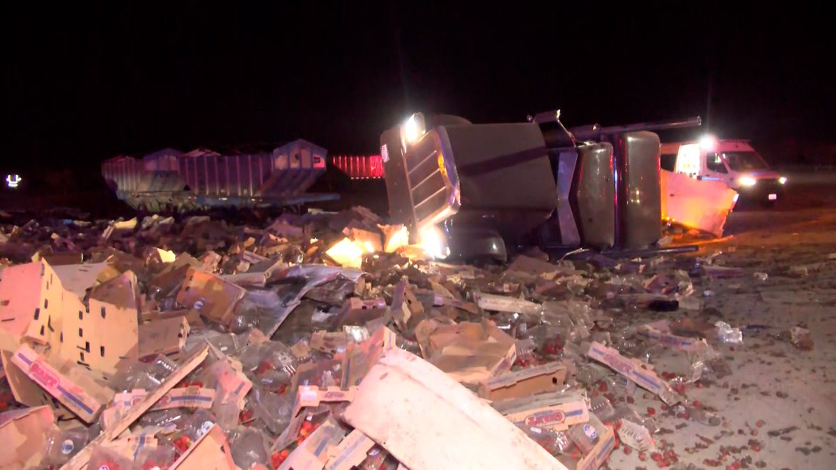 Two big rigs overturned in a crash early Friday morning west of Firebaugh, according to the California Highway Patrol