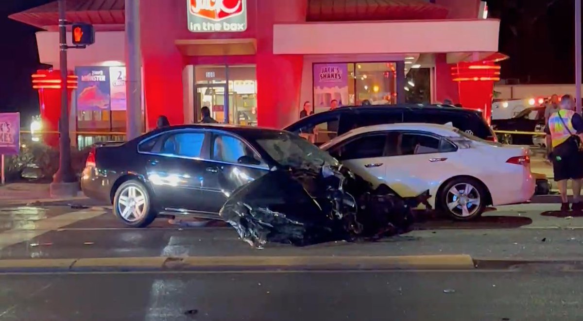 A Baton Rouge police officer has been arrested for negligent homicide after it was determined she ran a red light while rushing to a reported shootout and crashed into another vehicle, killing an  bystander