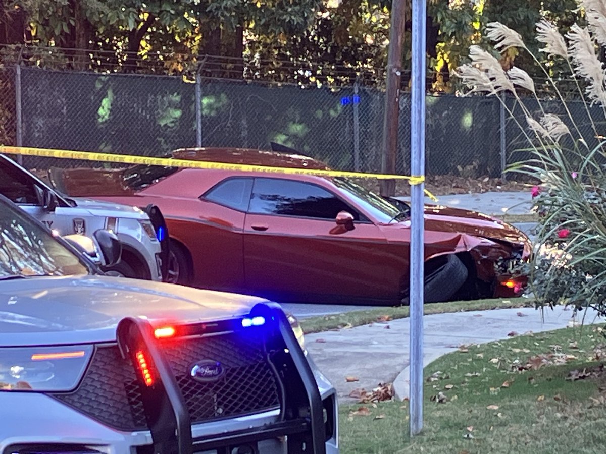 Dunwoody police shoot the driver of a stolen Dodge Challenger after he leads them on a chase into Brookhaven and pulls out a weapon, police say.