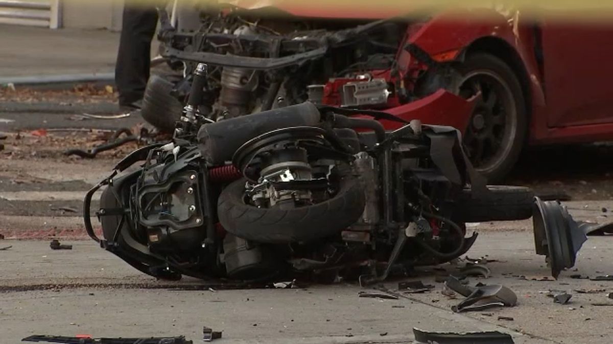 1 killed, 1 person in custody after car rams into moped in the Bronx