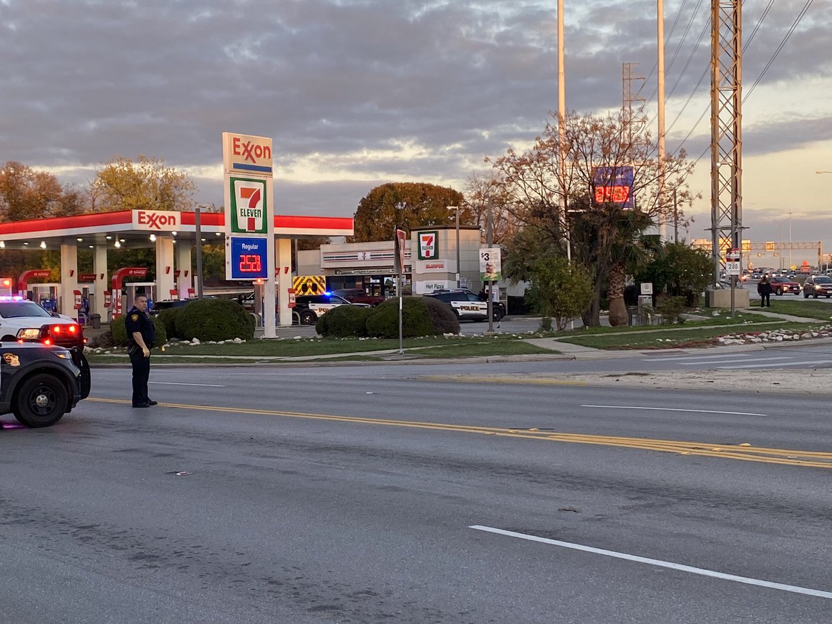 Police have long guns and shields out at this Exxon 7-Eleven on Fair Ave A group of people was escorted around the corner by officers with shields