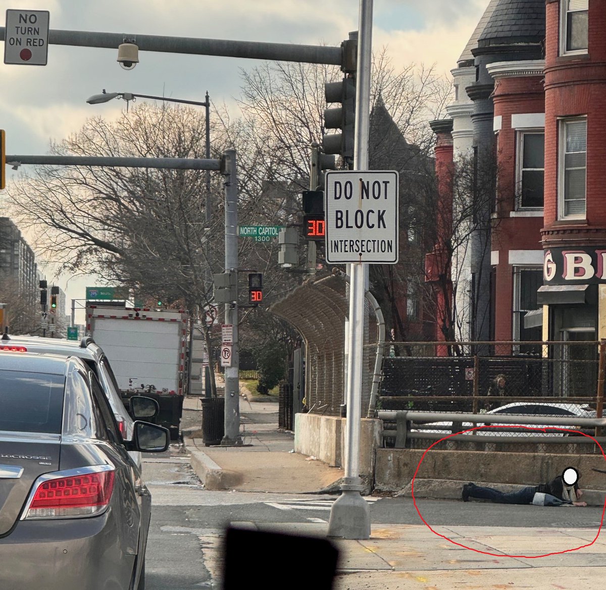 SHOOTOUT ON NORTH CAPITOL ST-- at New York Ave. Two persons reportedly stepped out of an auto and opened fire. Police have found ~36 shell casings so far. People dove for cover (see photo).  nobody found shot, yet, but there is damage to a residence on N St NW