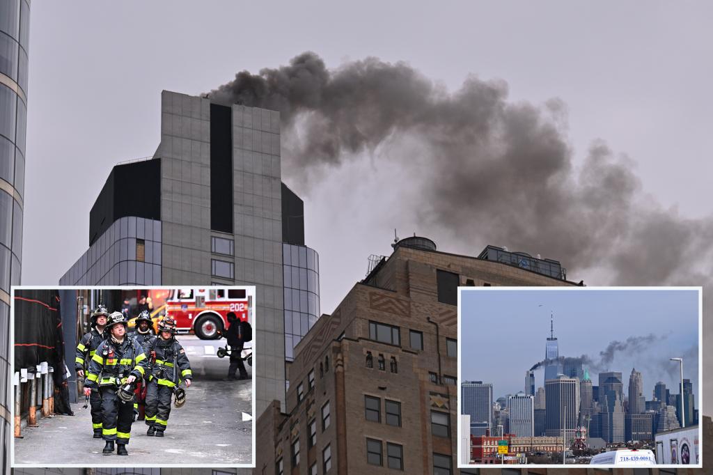 Thick smoke, flames burst out of skyscraper near World Trade Center after rooftop fire