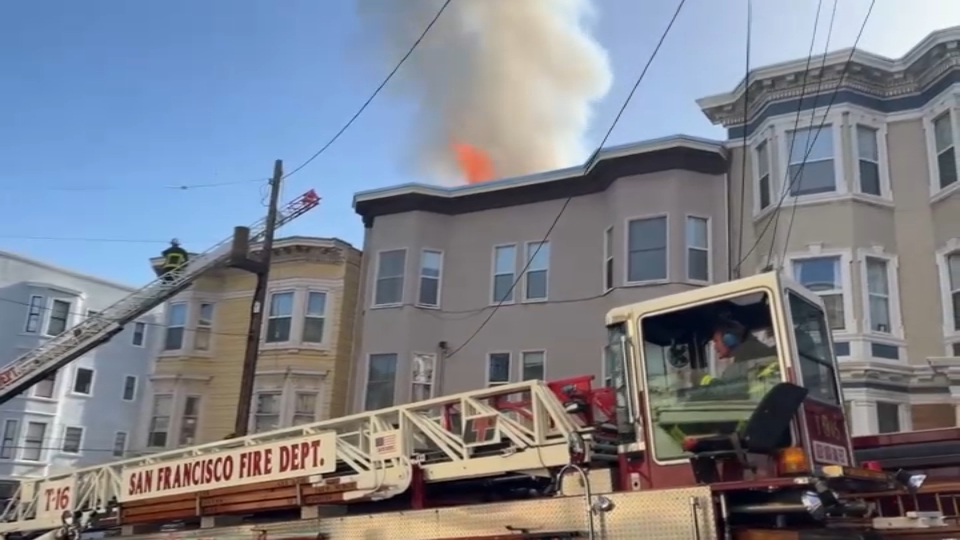 San Francisco firefighters are battling a two-alarm blaze in a building in the city's Nob Hill neighborhood