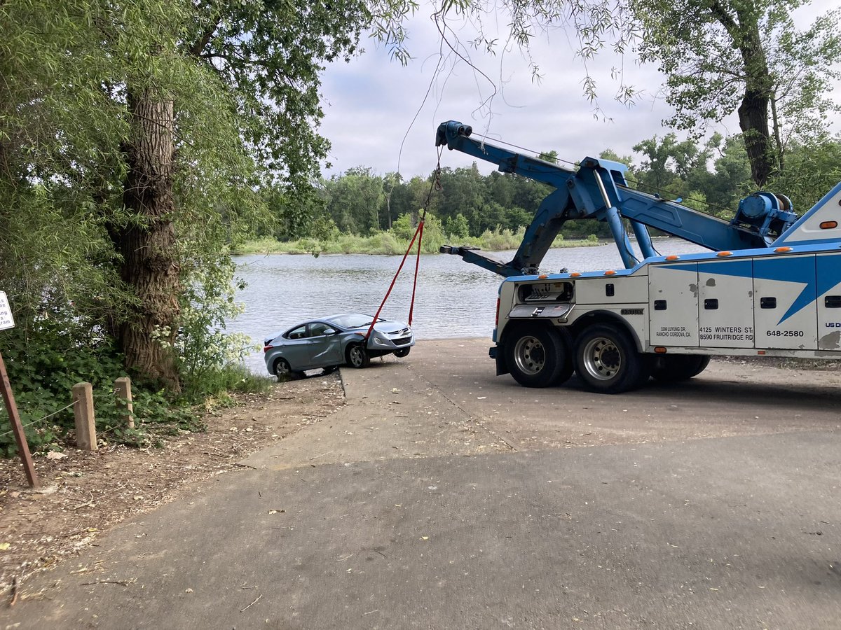 American River at La Riviera Dr. Crews located a vehicle about 200 feet out in the water that was unoccupied. Rescue 20 was able to hook the vehicle and pull it out with the assistance of Boat 8. No injuries