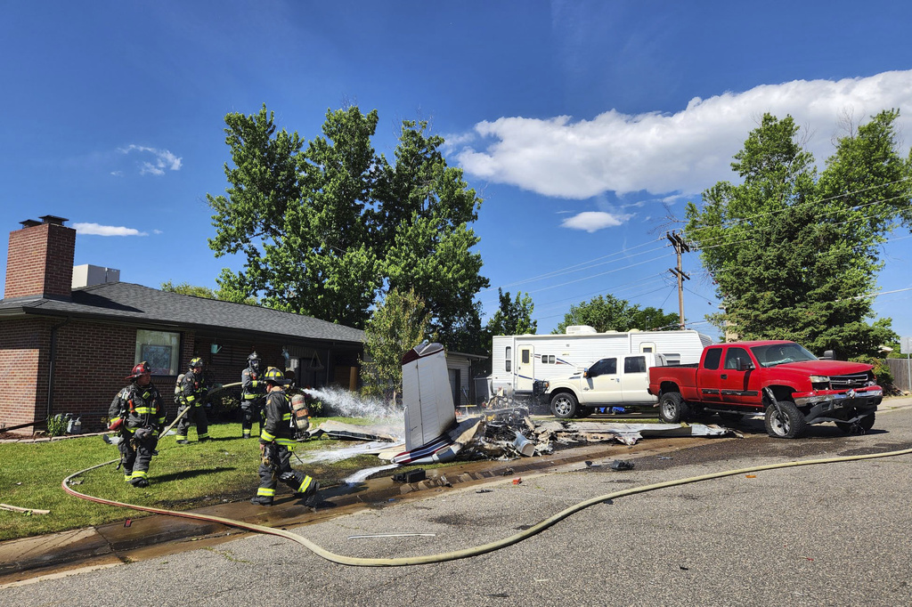 4 hospitalized after small plane crashes in yard after trying to land on street