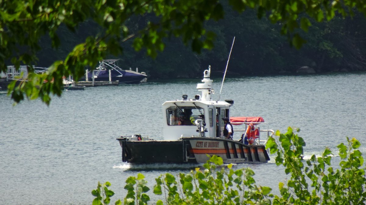 Two bodies have been found by a dive team during a search for missing swimmers in Candlewood Lake in Danbury, according to the Connecticut Department of Energy and Environmental Protection