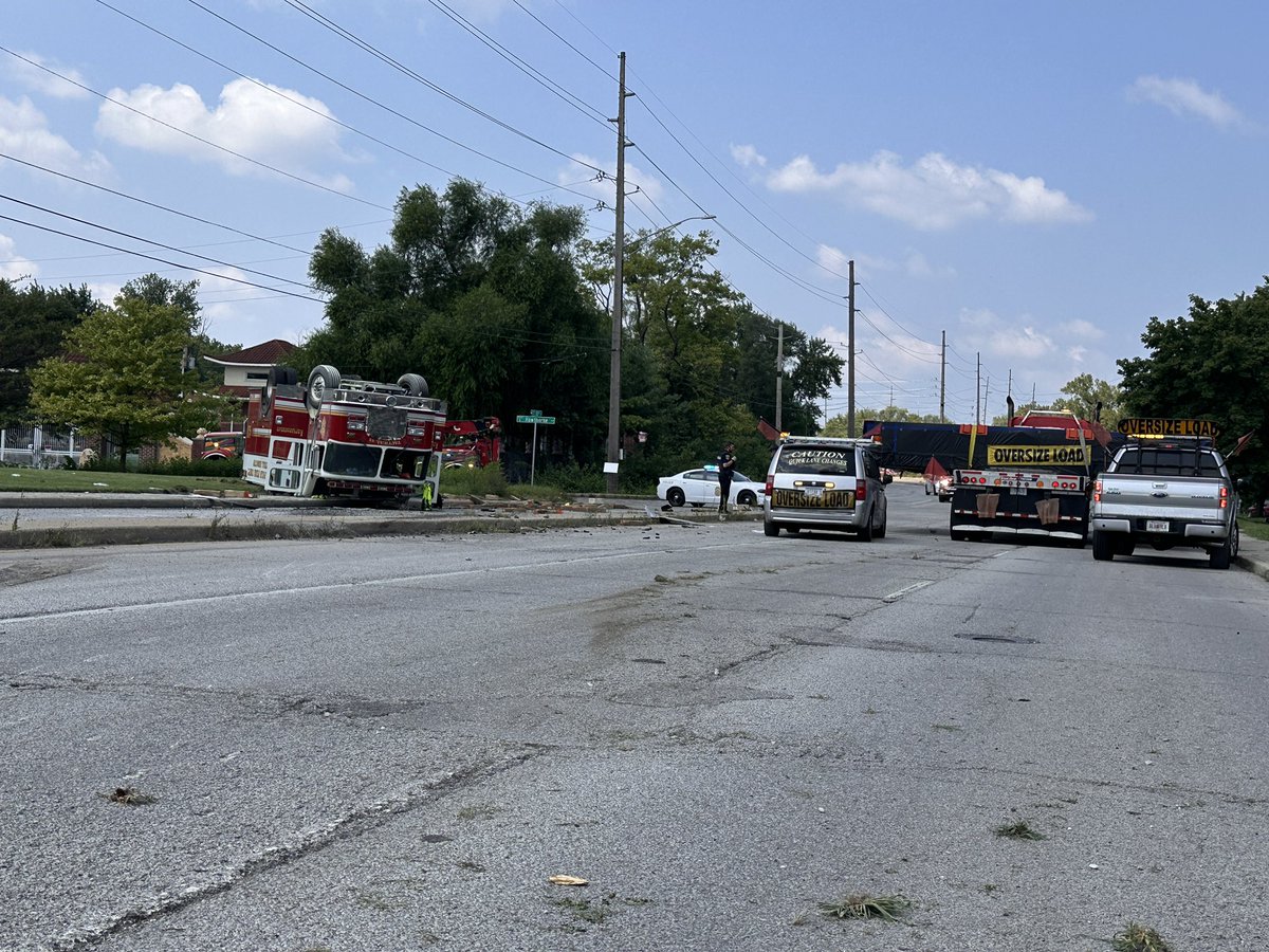 4 firefighters transported to hospital. 3 injured. Extent of injuries unclear. Firefighters were on the way to a crash nearby as police were escorting this oversized load