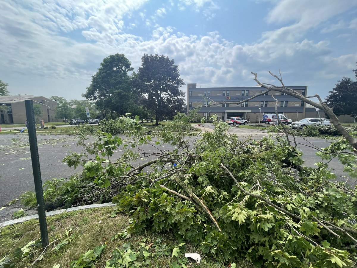 Amongst some of the wreckage you can see, what appears to be, some pieces of roofing and insulation from nearby buildings. The Neighborhood Health Center has a good amount of damage in the parking lot, and also a window pane broken at their entrance