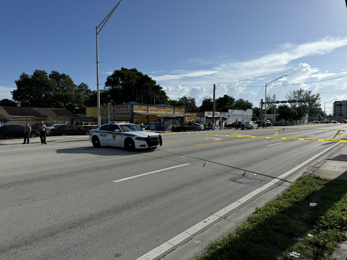 At least one person is dead after a shooting near Tropicana Bar on NW 79th St and  10th Court in Gladeview area. One body seen covered by tarp, several evidence markers on ground nearby. Police currently gathering evidence.