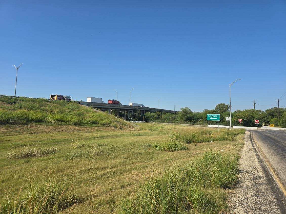 SA  pd along with Sa fire department are at a scene where a single vehicle is hinging from the side of a bridge. A tow truck is there to pull the car to safety. This at moursund rd and hwy 410. A lot of traffic. Avoid the area