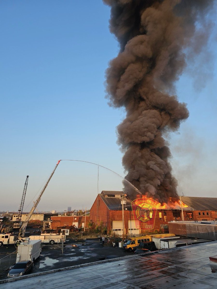 CFPA President Glenn Duda @allhandsworkin reports 1 tower ladder & 1 ladder stick are in operation as well as additional hand lines flowing water from the ground. Mutual Aid from East Haven has also arrived on scene