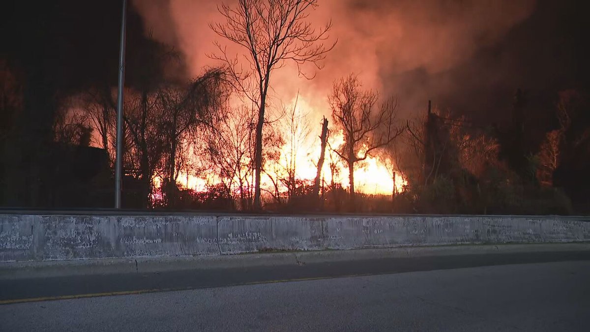 A large brush fire is ablaze in Woodberry as fire crews attempt to put it out.