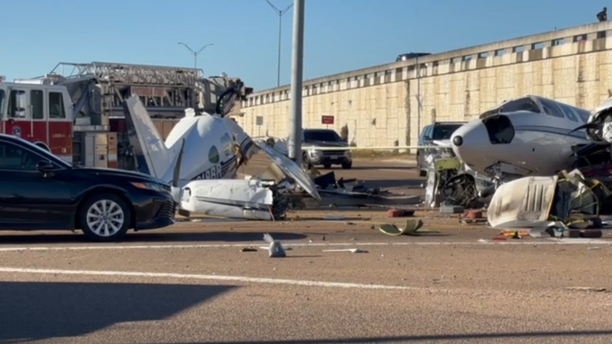 PLANE CRASH INJURES THREE    small, fixed-wing plane has slammed into three cars stopped at a Texas intersection