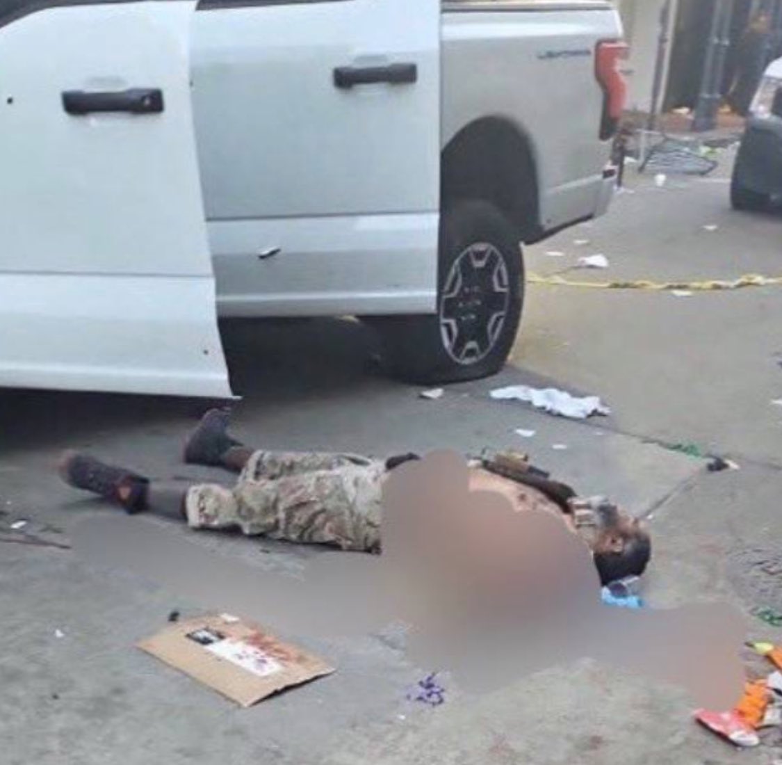 Image of suspected gunman seen laying deceased outside vehicle