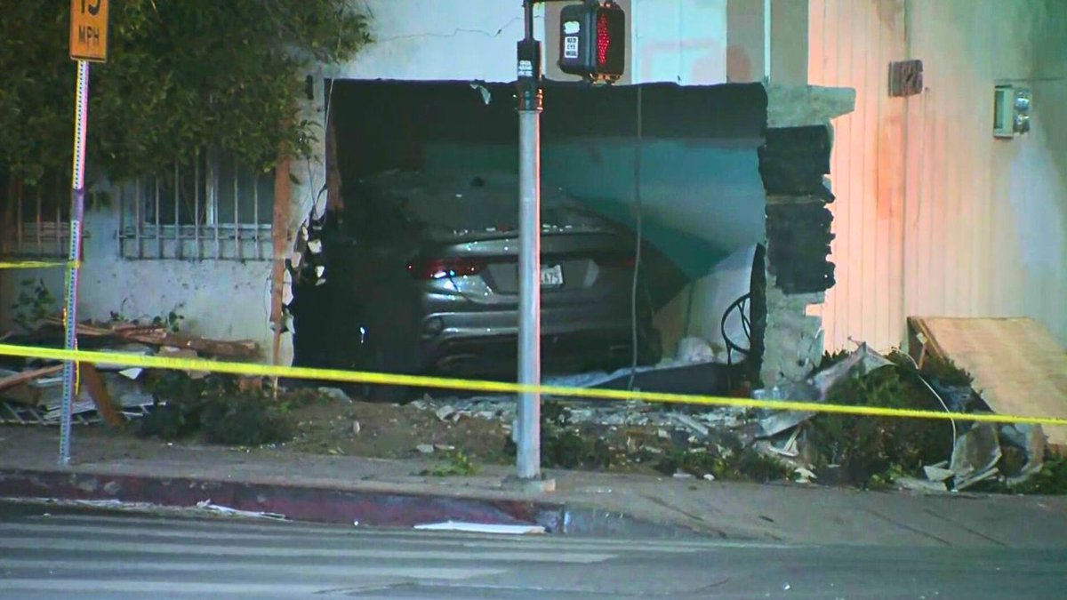 Man killed, 9-year-old boy seriously injured when car crashes through L.A. apartment