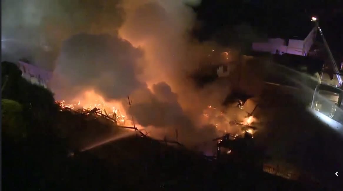 Firefighters remain on scene of the 3-alarm fire at the old Blue Heron Paper Mill in Oregon City. The fire was declared under control at 7:56 a.m