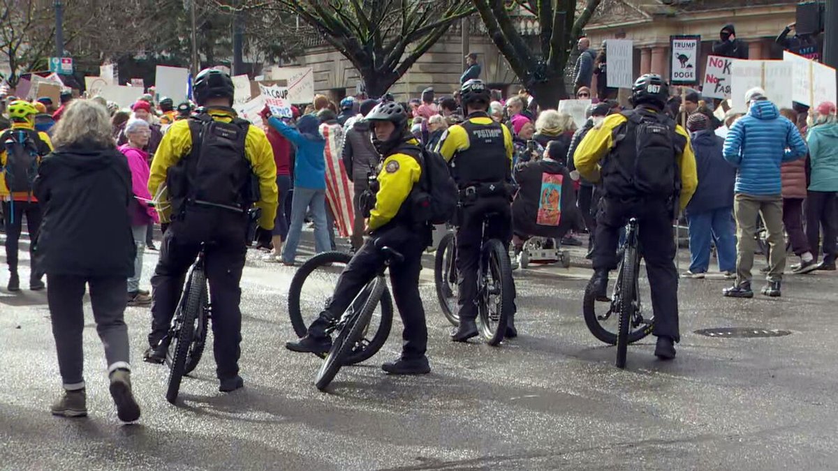 A group of protesters gathered at Portland City Hall on Monday.The demonstration is part of a national Presidents’ Day protest against recent federal layoffs, funding cuts, and other policies implemented by President Donald Trump's administration