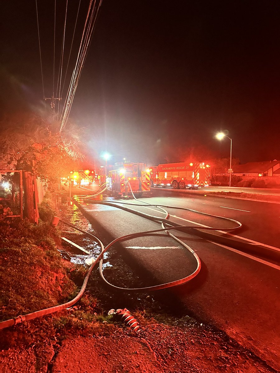 Crews arrived to a property with multiple modular homes actively involved with fire. The fire was threatening an adjacent home on another property, and property owners were doing what they could to contain the blaze with garden hoses.