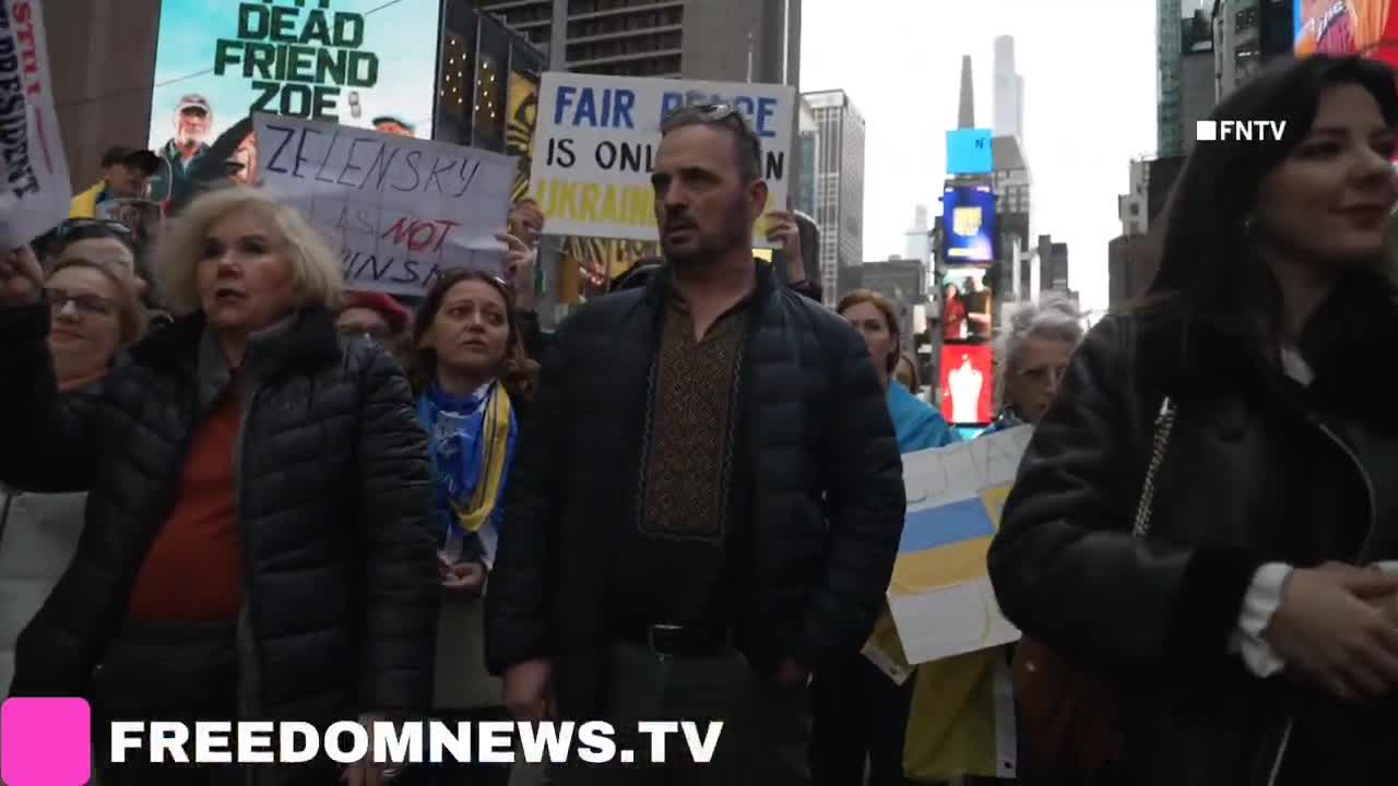 Ukrainians sing American national anthem as they gather in Times Square in Emergency protest